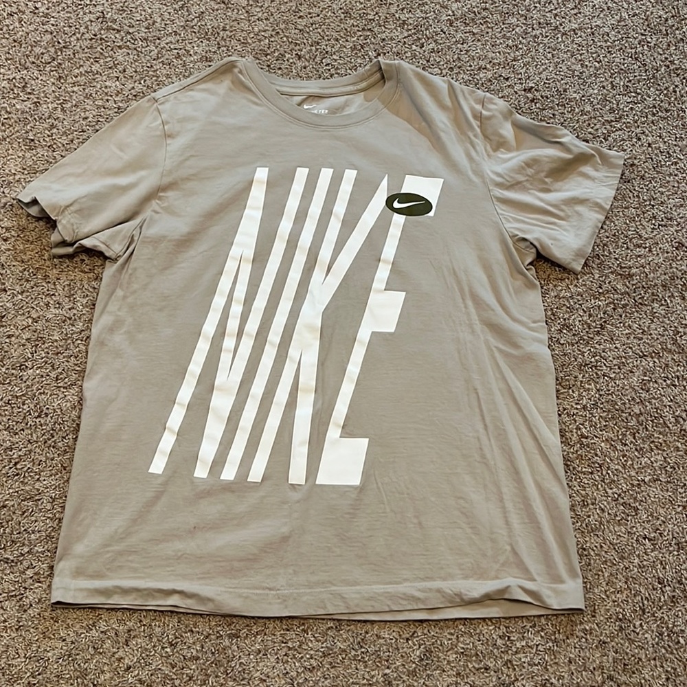 Nike, tan in color